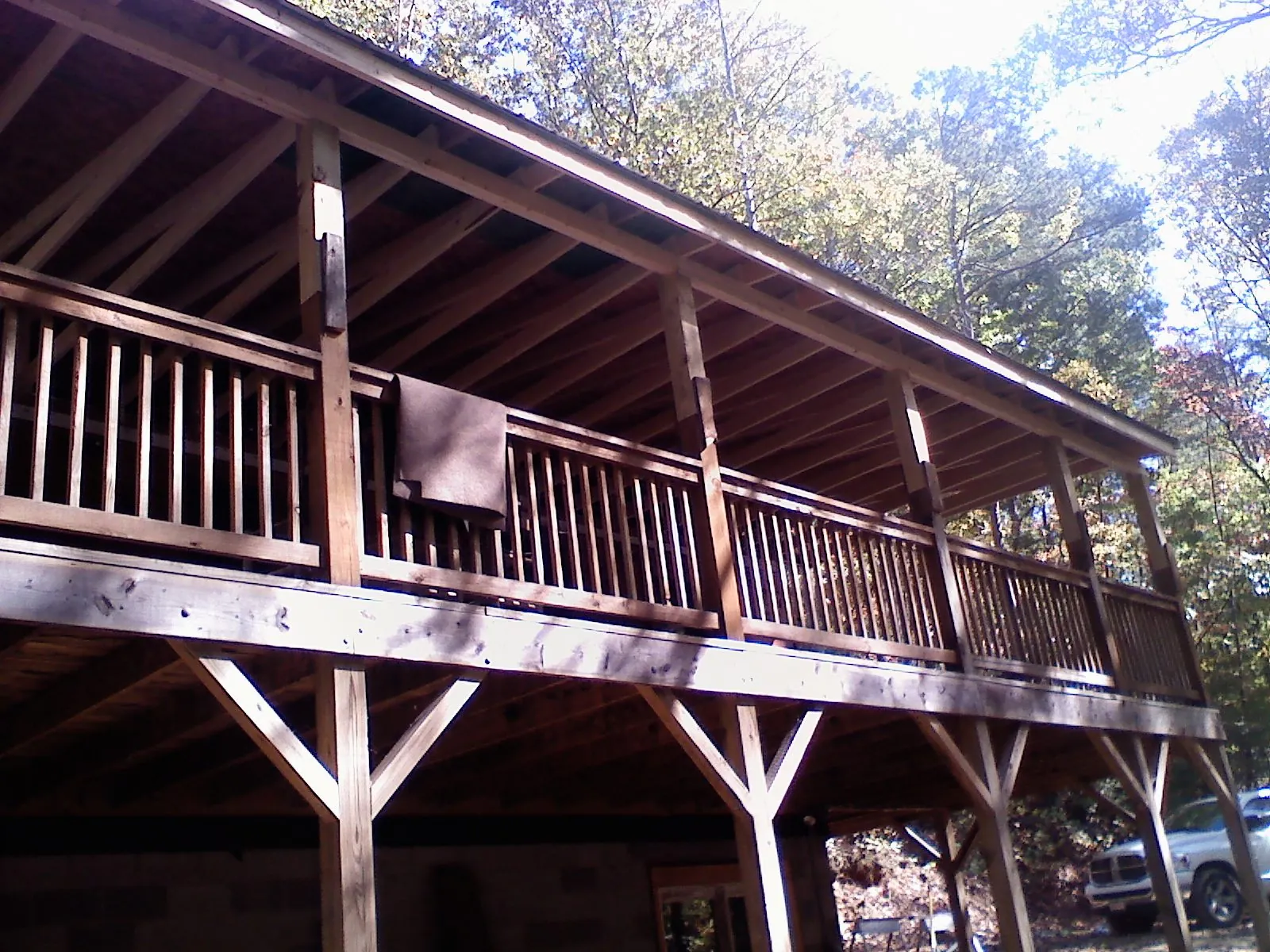 Timber framing under a new elevated porch and deck in Craig